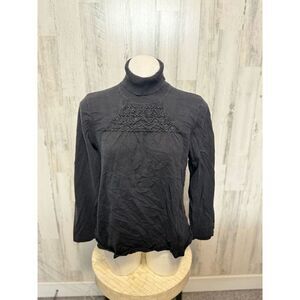 Black turtle neck sweater